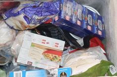 a bin full of food and other items