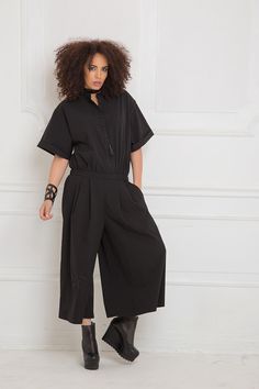 Black Jumpsuit, Women Romper, Black Overall Relaxed jumpsuit with fixed waistline and extra wide leg: |MEHRY| GARMENT FEATURES: *Striking yet comfy to wear all-in-one piece *Relaxed, loose silhouette *Mandarin collar with front buttoning *Wide mid length sleeves *Fixed waistline with elasticated back *Practical front pockets *Deep front pleats, two on each side *Extra wide leg in 7/8 length *Made from quality viscose blend fabric COLOUR OPTIONS: This product is available in the following colour Plus Size Harem Pants, Loose Fit Jumpsuit, Women Romper, Womens Black Jumpsuit, Japanese Clothing, Maxi Jumpsuit, Black Silk Dress, Romper Black, Gothic Clothing