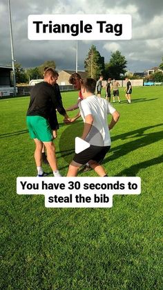 two men shaking hands on a soccer field with the words triangle tag in front of them