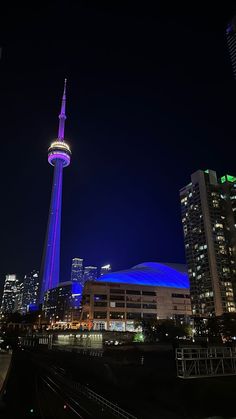 the sky tower is lit up in blue