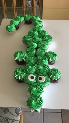 cupcakes shaped like a tree with googly eyes