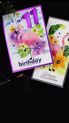 two birthday cards with flamingos on them, one is pink and the other is purple