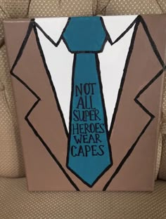 a painting of a blue tie with words on it that says not all superheros wear capes