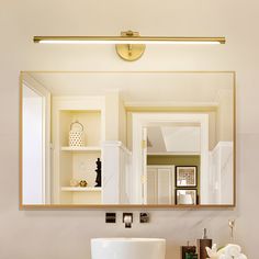 a bathroom sink with a mirror above it