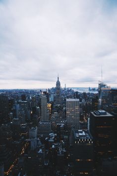 an aerial view of new york city at night from the top of the empire building