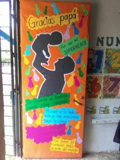 a bulletin board with an image of a woman holding a child in her arms and the words gracious papa on it