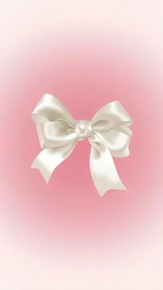 a white bow on a pink background