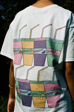 Stay cool this summer and drink Sluurpee. Grape, watermelon, peach, or strawberry. What's your flavour? Graphic print on the front and back Woven label details at bottom of t-shirt and inside the collar Relaxed fit, 100% soft cotton Unisex t-shirt Models are wearing a size L We use industry standard garments so recommend ordering the size you would normally wear. If you are between sizes then size up For women we recommend ordering the following sizes for a fitted shape: 6/8- small, 10- medium, 12- large, 14- x-large. If you would like an oversized fit we recommend ordering one or two sizes up depending on how oversized you'd like your t-shirt to be. Free stickers included in every order We have a 30 day no hassle return policy FREE delivery on all UK orders over £75 and international orde Woven Label, Be Free, White Short, Free Stickers, Stay Cool, Small Designs, This Summer, Graphic Prints, White Shorts