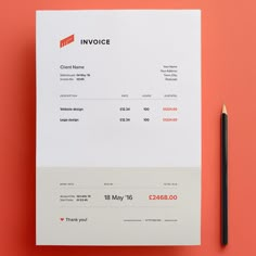 a white invoice sitting on top of a table next to a black pencil