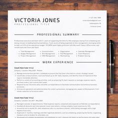 a professional resume is shown on top of a wooden table