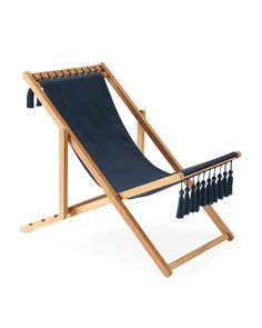 a wooden chair with tassels on it