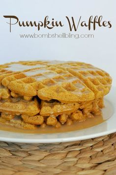 a stack of waffles sitting on top of a white plate