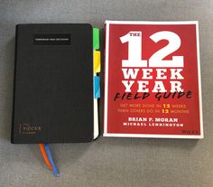 the 12 week field guide is next to a notebook with colored markers on it and a notepad