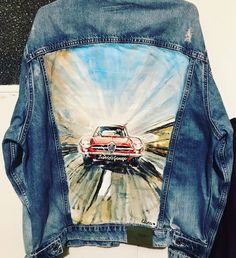 a jean jacket with an image of a car on it