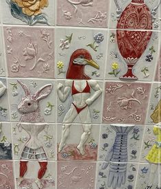 a tiled wall with many different designs on it