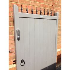 an open door to a brick building with wrought iron bars on the top and bottom