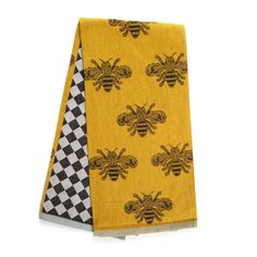 a yellow scarf with black and white checkered design on the front, and a bee pattern on the back