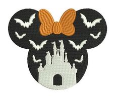 a mickey mouse head with bats on it and a castle in the background that says halloween