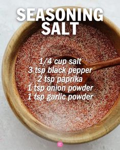 a wooden bowl filled with seasoning salt