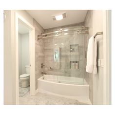 a bathroom with a glass shower door