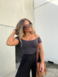 Details Ribbed Knit Off the Shoulder Top Color: Black Material: Knit Size Runs True to Size Model is Wearing a Size M/L Model Measurements Size: 4 Height: 5'2" Weight: 135lbs Bust: 35" Waist: 26" Hips: 35" Bra Size: 35C Black Top For Day Out, Black Seamless Tops For Fall, Black Seamless Top For Fall, Black Knit Top For Day Out In Fall, Black Stretch Knit Top For Night Out, Casual Solid Knit Top For Night Out, Casual Solid Color Knit Top For Night Out, Stretch Solid Knit Top For Day Out, Black Knit Top For Fall Day Out