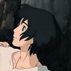 a woman with black hair and blue eyes is staring at something in the distance while she's holding her hand on her shoulder