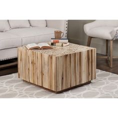 a coffee table made out of wood with books on top