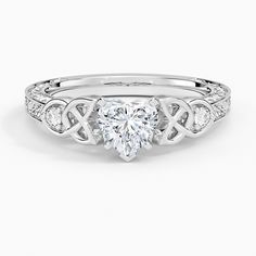 a heart shaped diamond ring with an intricate design on the shan shan shan shan shan shan shan