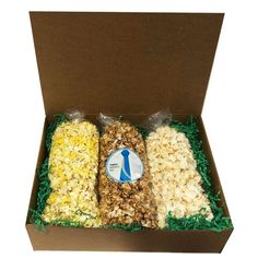 an open box filled with different types of popcorn