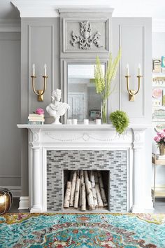 a living room with a fire place and rug