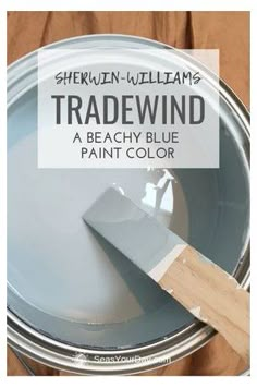 a close up of a paint can with the words tradewind painted on it in white