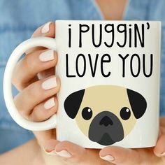 a woman holding a coffee mug with a pug in it's face that says i puggin'love you