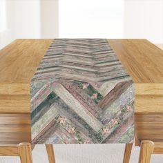 a wooden table topped with a chevroned design on it's top and bottom