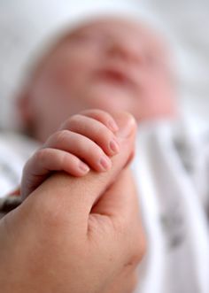 a close up of a person's hand holding something