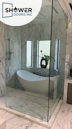 a white bath tub sitting inside of a bathroom next to a walk - in shower