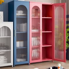 three different colored cupboards in a living room