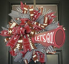 a football wreath is hanging on the front door