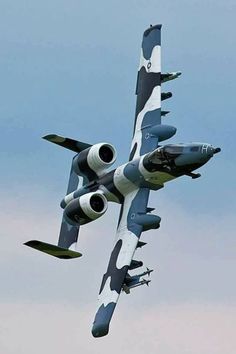 an air force jet flying in the sky with four engines on it's side