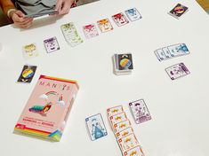 playing cards are arranged on a table with children's books