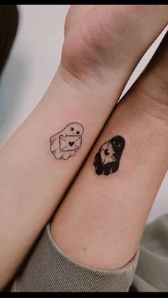 two people with matching tattoos on their wrist