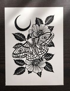 a black and white drawing of a butterfly with flowers on it's back side