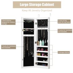 the large storage cabinet is open and has jewelry hangings on each side, including necklaces