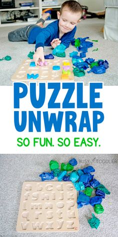 a young boy playing with puzzles on the floor