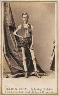 an old photo of a young man standing in front of a curtain