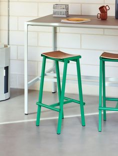 Created by Spanish designer Marc Morro, Taburete 8 Bar Stool uses direct design language to create a functional and robust bar stool with a distinct yet minimalistic expression. Made with a plywood oak veneered seat and a strong welded-steel tube base, the Taburete 8 Bar Stools are enhanced by their raw geometric simplicity and bold use of colour, creating a striking yet understated piece. Also by using essentially off-the-shelf components, an exceptionally low price is achieved. The curved seat Bar Stool Industrial Design, Minimal Cafe, Copenhagen Furniture, Outdoor Side Tables, Metal Stool, Lighting Gifts, High Stool, Hallway Kitchen, Stationery Storage