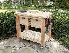 a small wooden table with tools on it