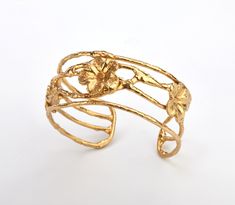 A picturesque gold toned brass wire framed cuff with three flowers floating on gently flowing wires.  The wire framing is flexible enough to allow size adjustment. Questions: please send me a message. Floating Flower, Three Flowers, Wire Cuff, Floating Flowers, Wire Frame, The Wire, Cuff Bracelet, Cuff Bracelets, Jewelry Bracelets