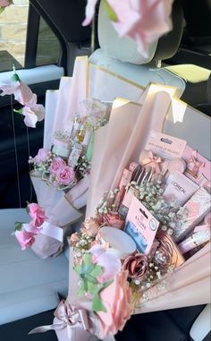 a bouquet of flowers sitting on top of a table in the back of a car