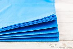 blue paper folded on top of each other