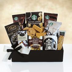 a starbucks gift basket with cookies, crackers and coffee